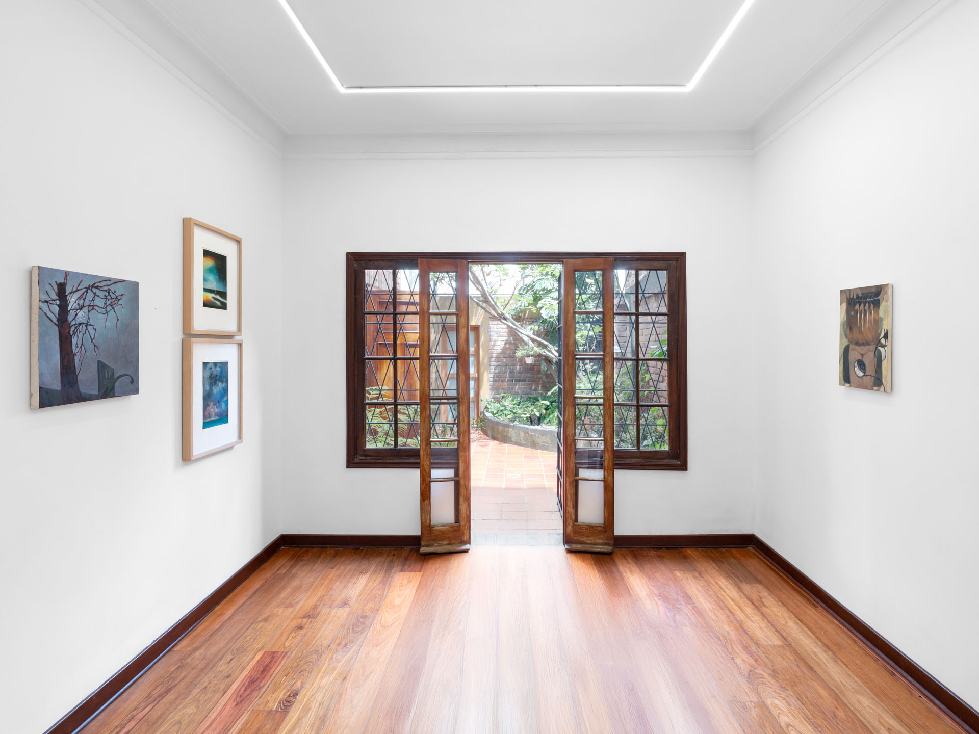 Installation view of "Pactos con sombras y fantasmas" featuring works by Antonio Imedio and Felipe Barreiro Carvajal at Galerie Hugo Dufon, Bogotá.
